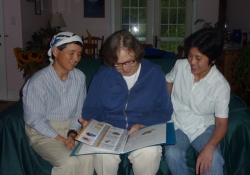 Takako, Mary Ellen and Er with kids books